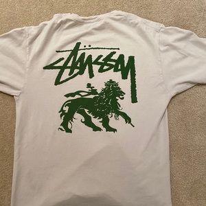 Green and white Stussy shirt.